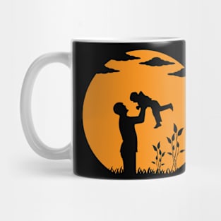 Father and Son Embracing Against the Sunset Mug